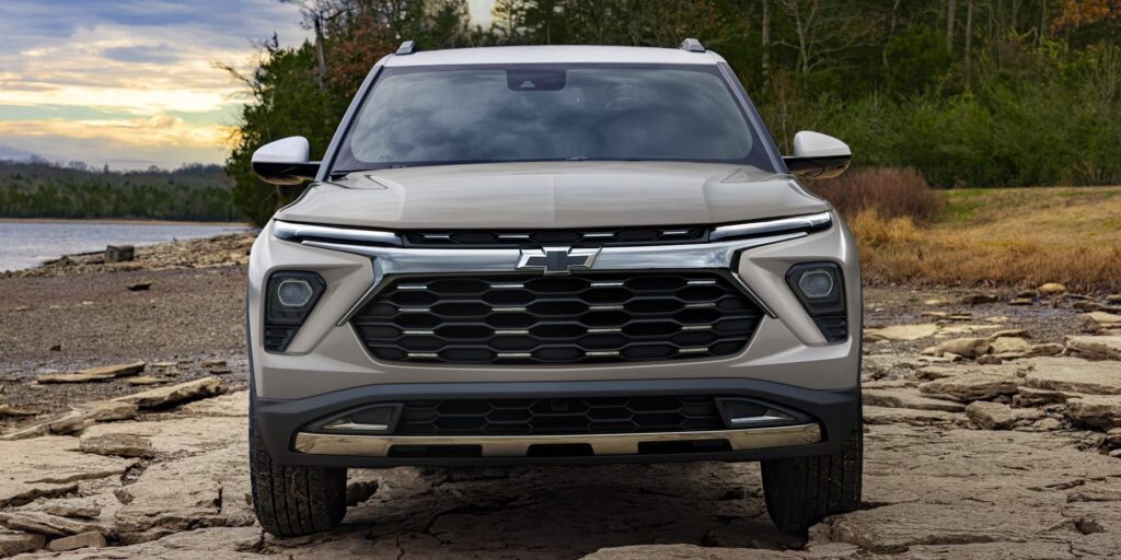 2026 Chevrolet Trailblazer front view of a silver suv on rocky lakeshore